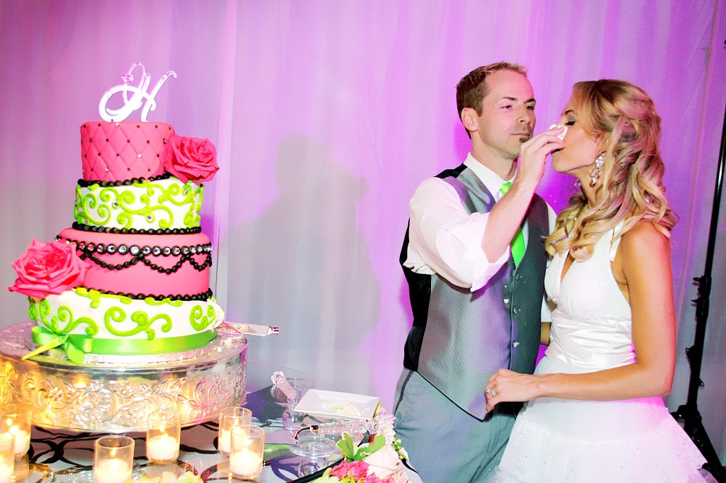 Groom smears cake on bride