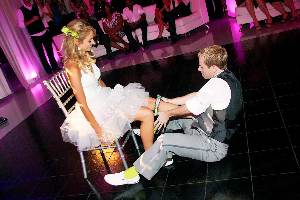 Groom fetching garter